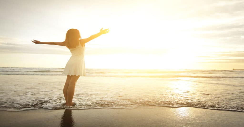 woman standing on the beach