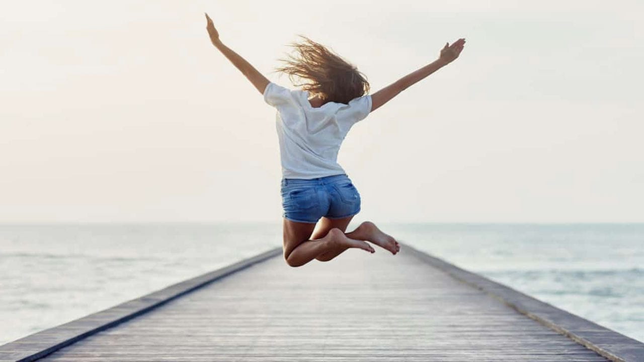 Woman jumping happily
