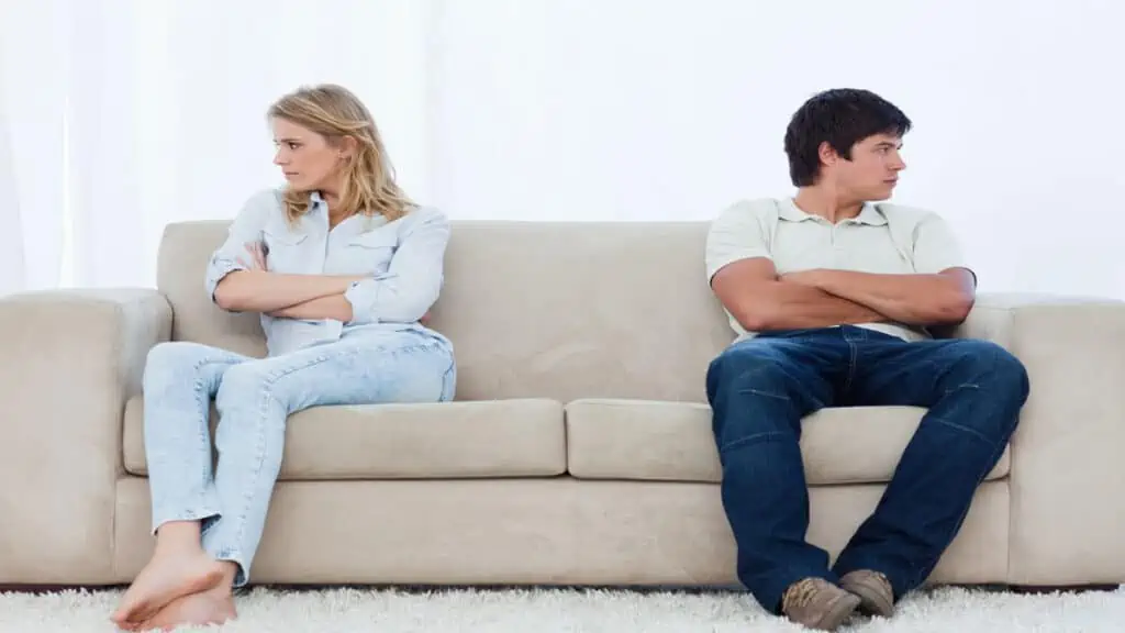 couple arguing on couch