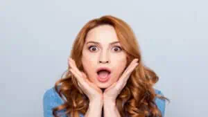 shocked red haired woman