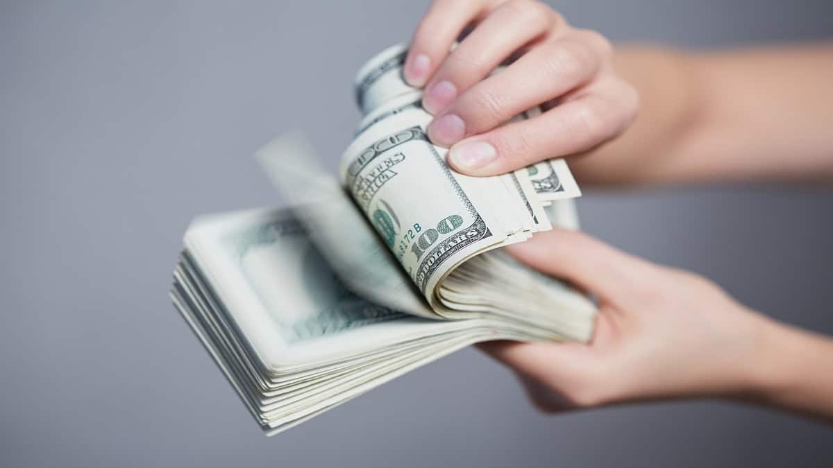 person holding cash