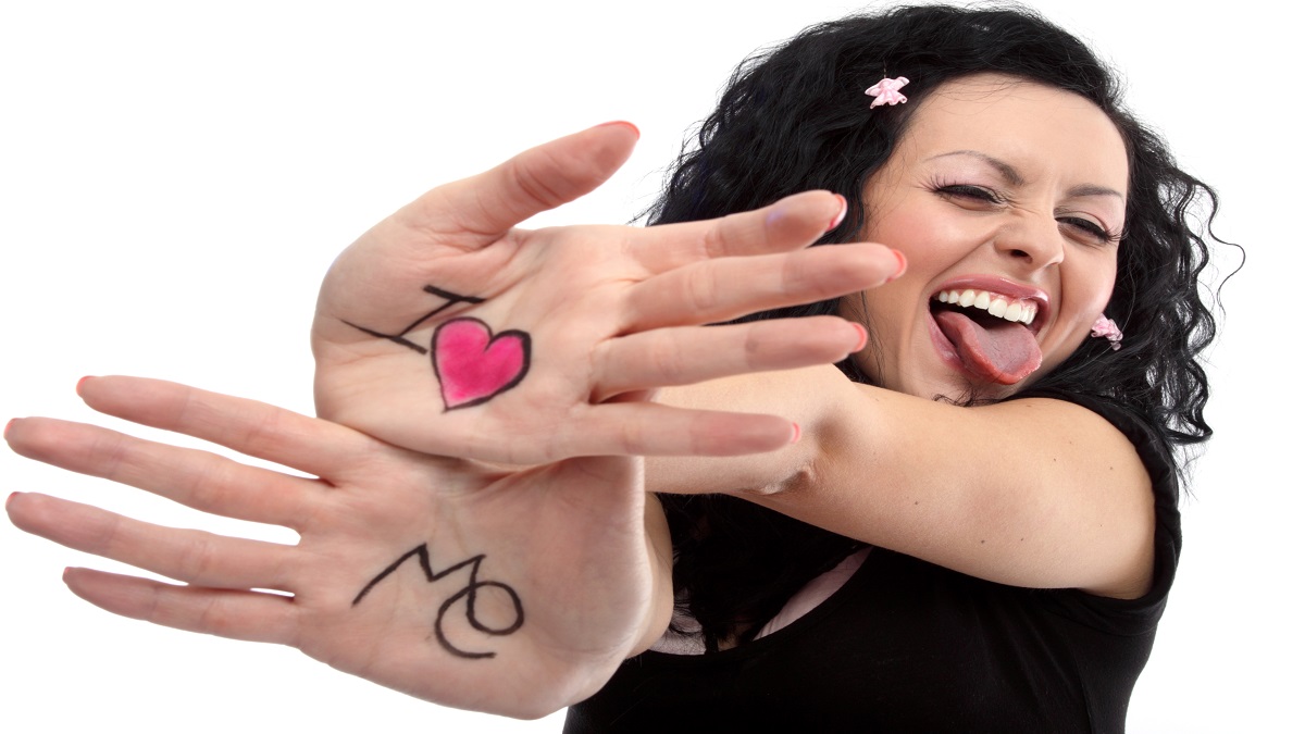 woman with i love me on hands