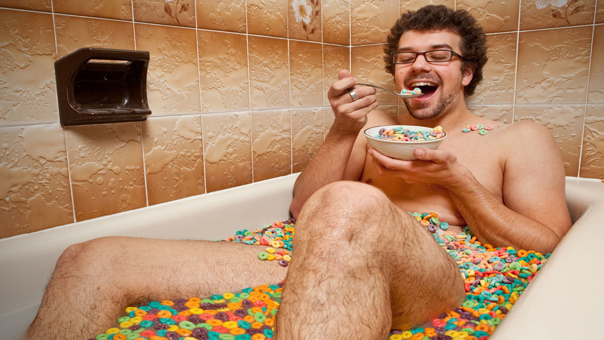 man-eating-cereal-in-tub